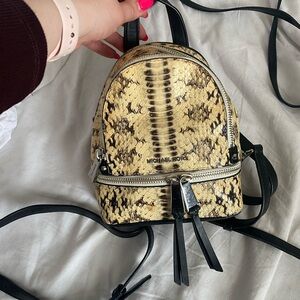 Michael Kors Black and Cream Mini Backpack with Snakeskin Design
